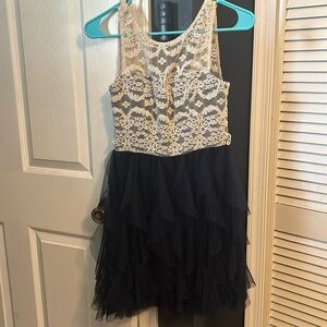 Blue ruffle bottomed dress with white lace top